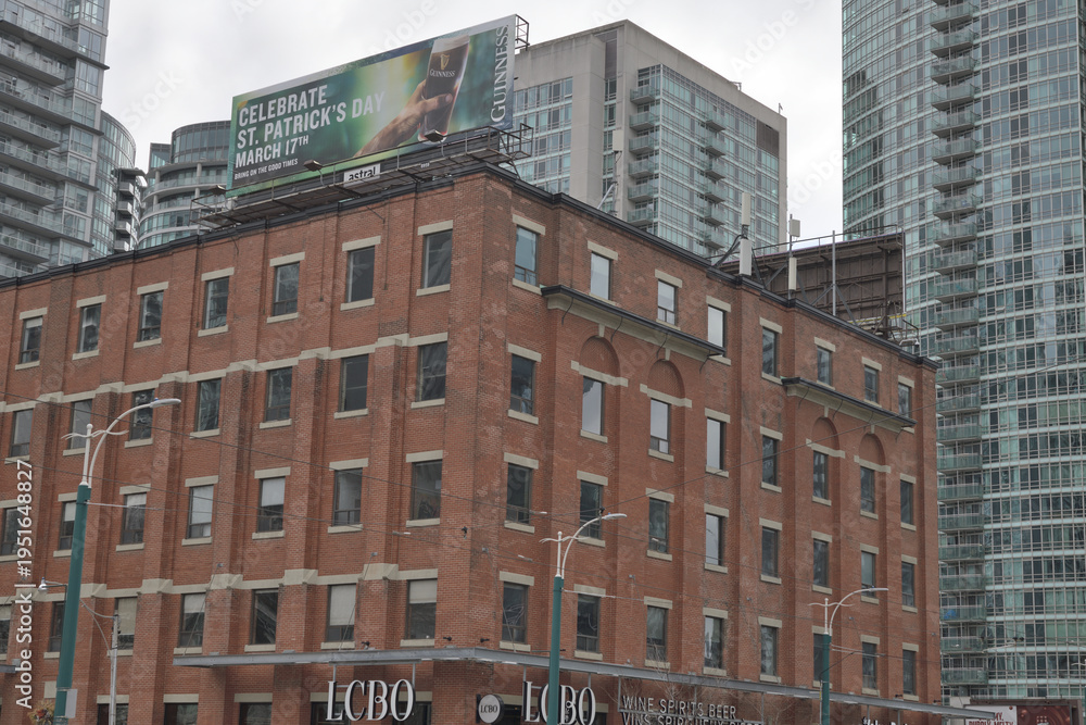 Obraz premium old building and sign of LCBO, a liquor store chain, located here at 49 Spadina Av, Toronto