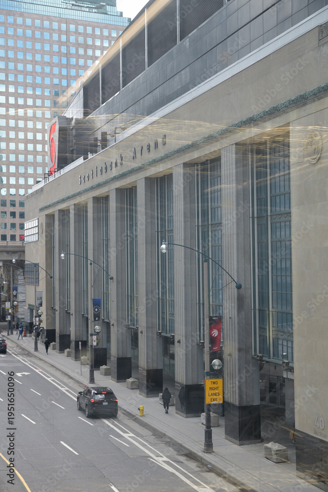 Fototapeta premium through-glass-window view of exterior facade and sign of Scotiabank Arena, 40 Bay St, Toronto