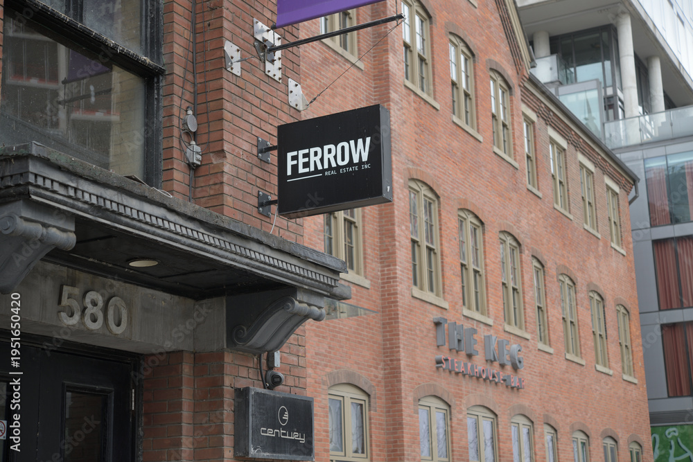 Obraz premium wall mounted projecting sign of Ferrow (real estate) and The Keg (560 King St W), Toronto