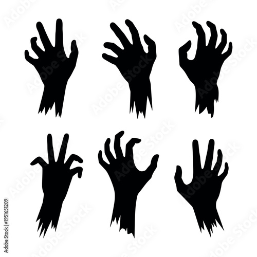 A set of black zombie hands reaching up in the air