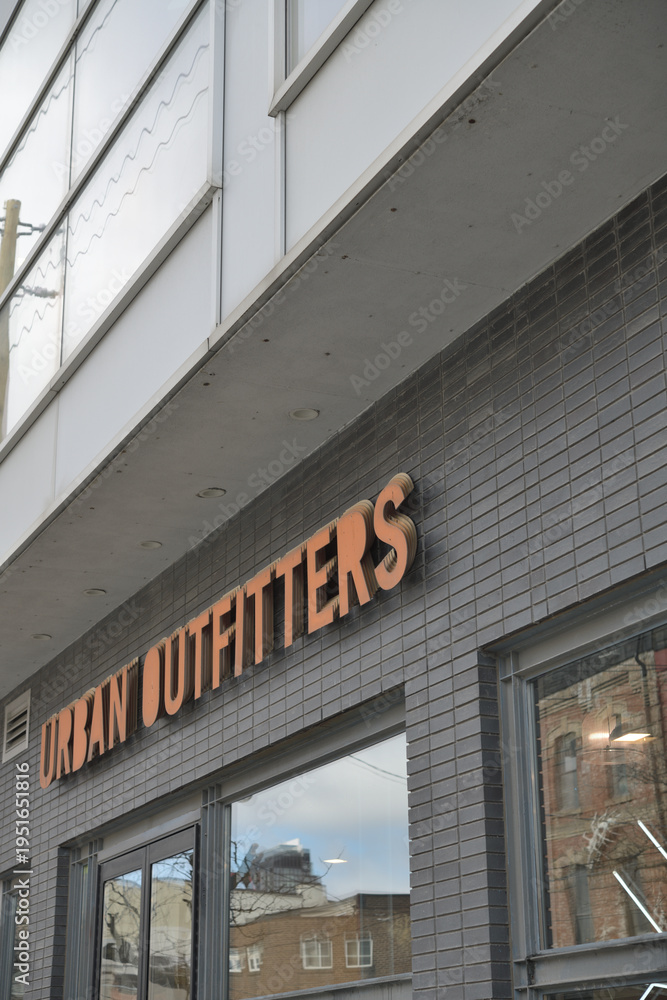Fototapeta premium exterior building facade and sign of Urban Outfitters, a clothing store chain, located here at 481 Queen St W, Toronto