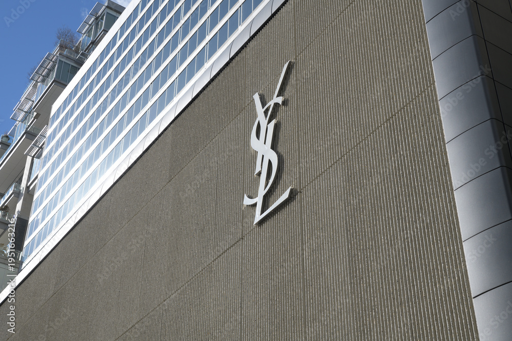 Obraz premium exterior building facade and logo sign of Saint Laurent, a clothing store, located here at 110 Bloor St W, Toronto