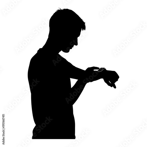 Silhouette of a man checking a smartwatch on his wrist for wearable technology and digital lifestyle concept