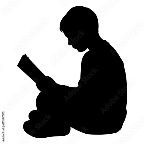 Silhouette of a young boy sitting and reading a book for education and childhood literacy concepts