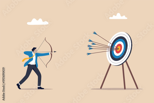 A businessman focusing on his professional goals by aiming an arrow at a target on a yellow field