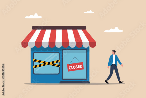 A man walking past a small local store that has been permanently closed with caution tape signs
