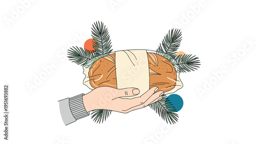 Human hand holding a freshly baked loaf of bread wrapped in paper and decorated with green pine branches for a rustic feel.