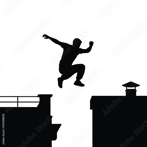 Silhouette of person jumping between rooftops of buildings