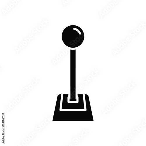 Black and white joystick with a circular handle and rectangular base