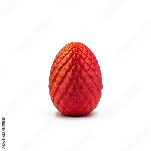 Red 3D printed dragon egg with scale texture isolated on white background