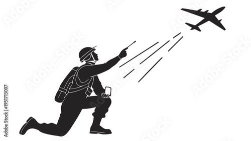 Air support team member signals to approaching airplane for landing guidance on runway