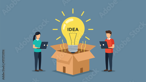 Creative professional team standing next to a large glowing lightbulb inside an open cardboard box representing an out of the box idea.