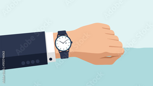 Close up of a businessman's hand wearing a stylish analog wristwatch indicating the time for an important meeting or project deadline.