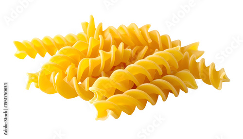 Close-up of uncooked, golden fusilli pasta, scattered against a black background