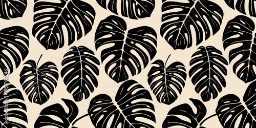 Seamless pattern of black monstera leaves on a cream background