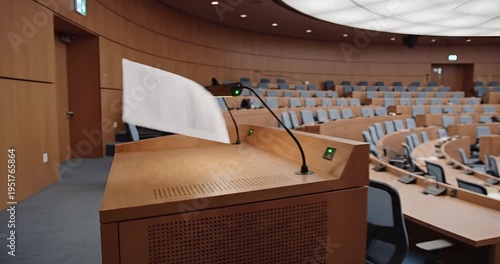 Empty Conference Hall with Microphone on Wooden Desk