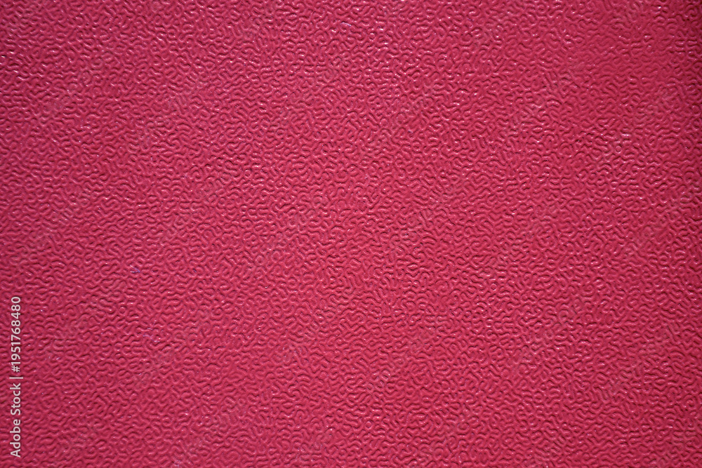 Fototapeta premium Pink textured paper substrate backdrop with fibrous material and coarse grain pattern. The high-resolution surface features a natural distressed matte finish, ideal for minimalist graphic designs