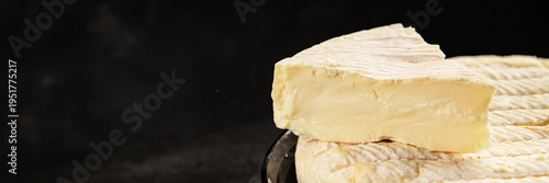 Soft cheese Camembert, Brie, or Coulommiers cheese head tasty snack fresh gourmet food background on the table rustic food top view copy space marketing concept photo