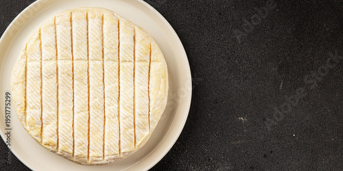 Soft cheese Camembert, Brie, or Coulommiers cheese head tasty snack fresh gourmet food background on the table rustic food top view copy space marketing concept photo