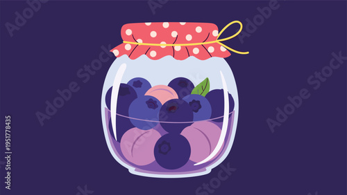 Jar of blueberry jam features a glass container filled with berries and a red polka dot fabric lid tied with a yellow string.