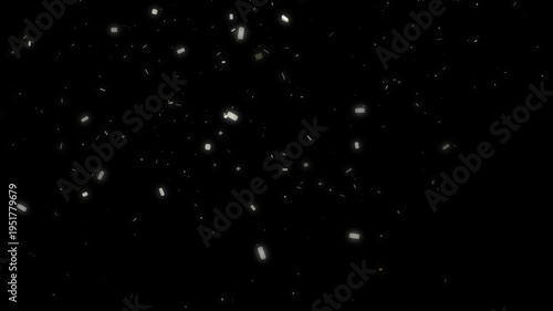 Warm golden shimmering dust particles slowly drifting and glowing against a deep dark background motion