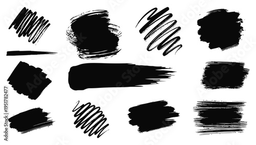 Collection of black brush strokes and smudges on white background