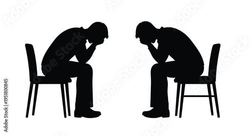 Two people sit in chairs heads bowed in apparent sadness silhouette