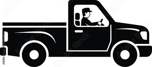 Black silhouette of a man driving a pickup truck