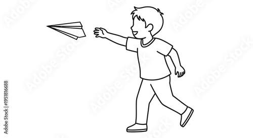 A young boy joyfully launches a paper airplane outdoors with a running start