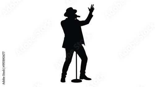 A man in a suit and hat singing into a microphone