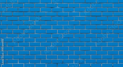 A blue brick wall with white grout