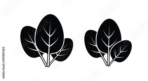 Two clusters of leaves depicted in a striking black silhouette