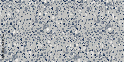Abstract speckled pattern featuring shades of gray and blue tones
