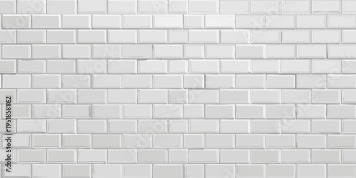 Close up of a white subway tile wall with a repeating rectangular pattern