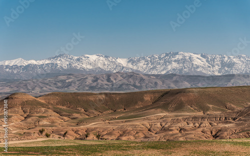 View of Agafay Desert with High Atlas Mountains in Morocco