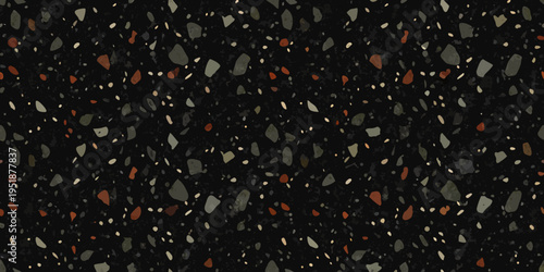 Dark speckled texture with scattered fragments of varying colors
