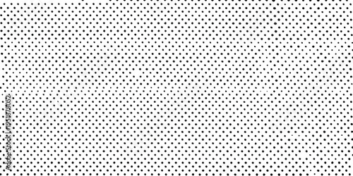 A dense repetitive pattern of small black dots on a white background