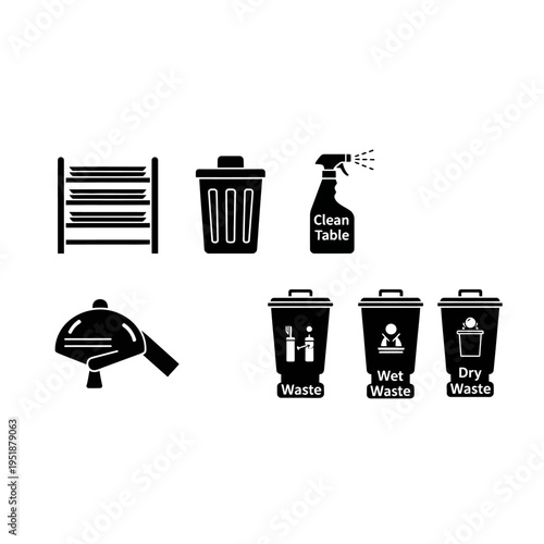 Cleaning supplies and waste bins organized on a table indoors