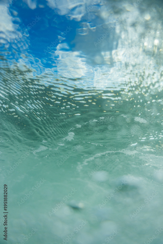 Fototapeta premium underwater surface view with clouds and ripples