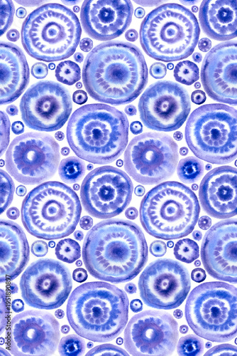 Seamless pattern of concentric tie-dye patterns in blue and purple tones, print for fabric and other designs.