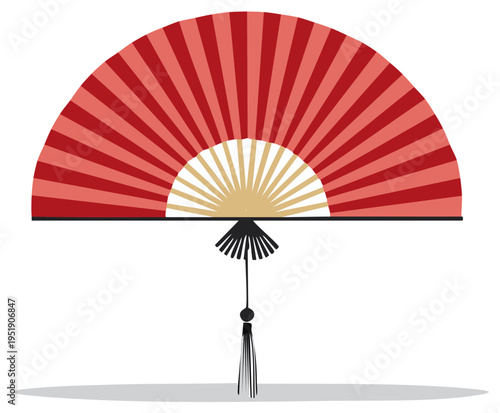 Traditional red folding fan with ornate tassel on white background