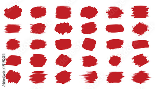 A collection of thirty two red lipstick imprints on a white background in four rows of eight