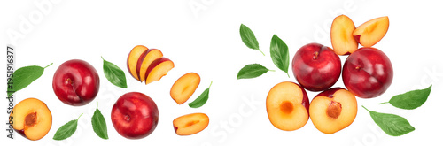 fresh red plum and half with leaves isolated on white background with copy space for your text. Top view. Flat lay