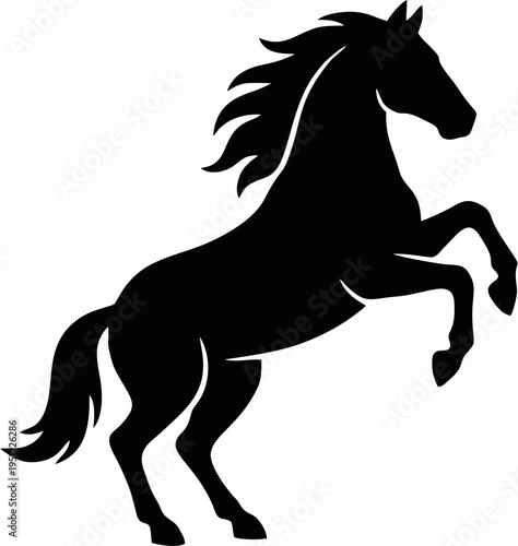 Black silhouette of a powerful wild mustang horse rearing up on hind legs