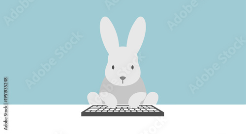White rabbit on a keyboard computer.
