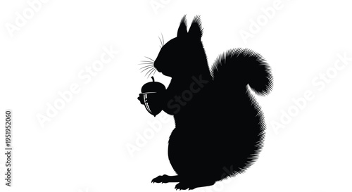 A black silhouette of a squirrel holding an acorn detailed silhouette