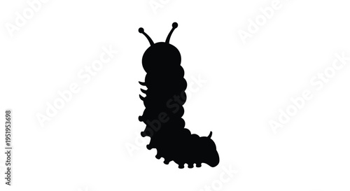 A striking black silhouette of a caterpillar crawling forward