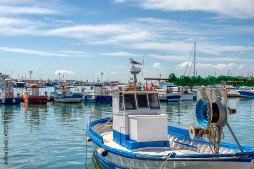 Port of Santa Pola, Alicante, Spain Fishing tradition and a seagull on top of a small fishing boat