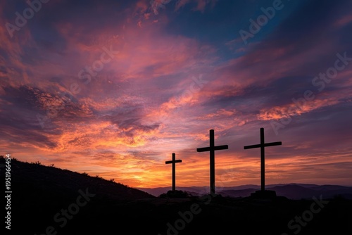 Three Crosses on Hill at Vibrant Sunset