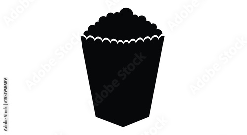Simple black container filled with fluffy popcorn a dark silhouette